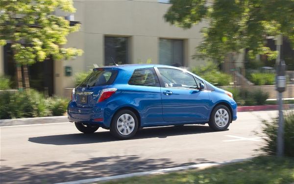 2012-toyota-yaris-rear-three-quarters-in-motion-2